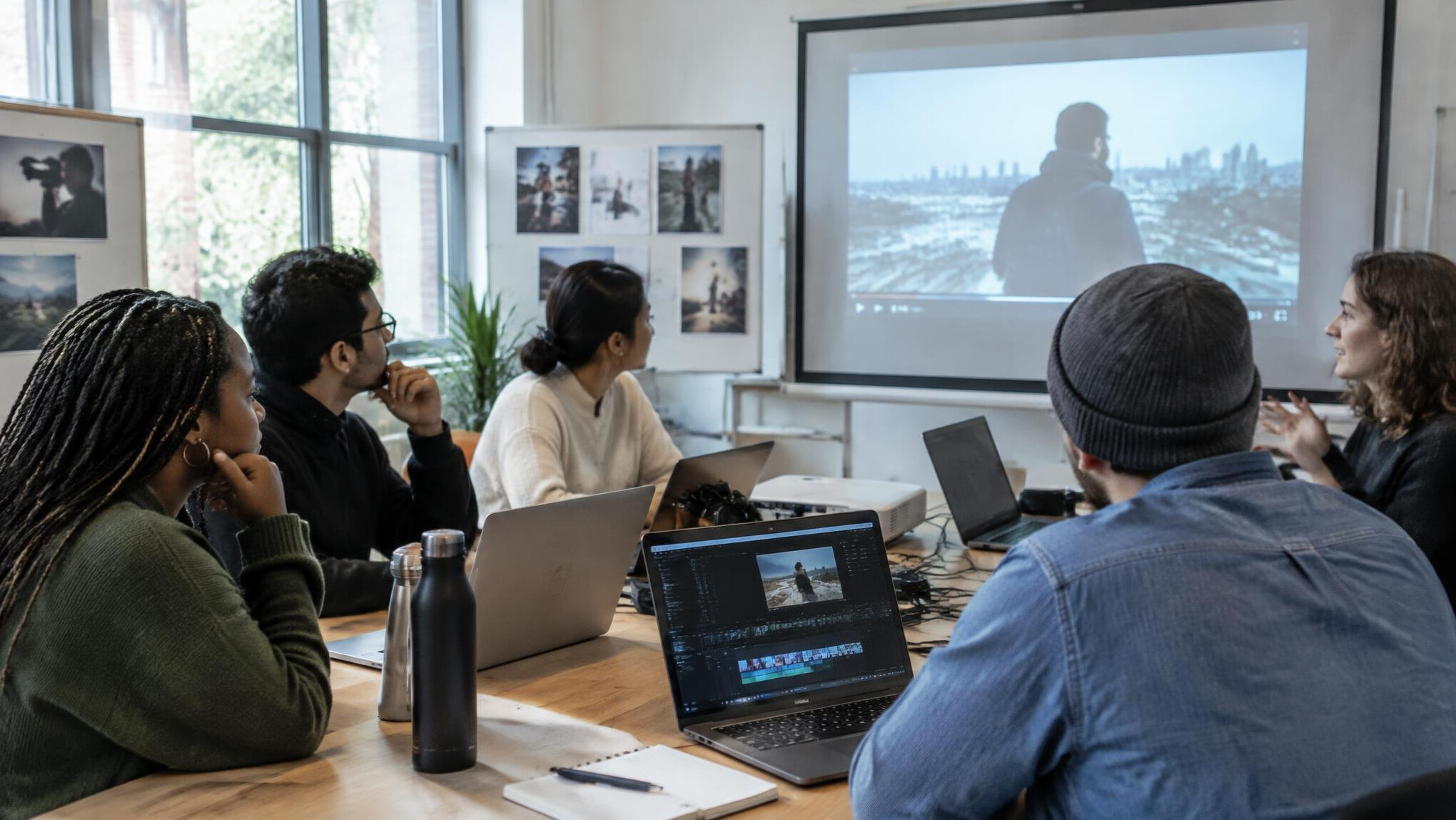 Small group workshop with screens and notes